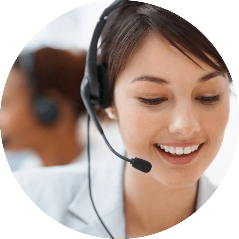 Customer Representative With Headset Smiling During a Telephone Conversation