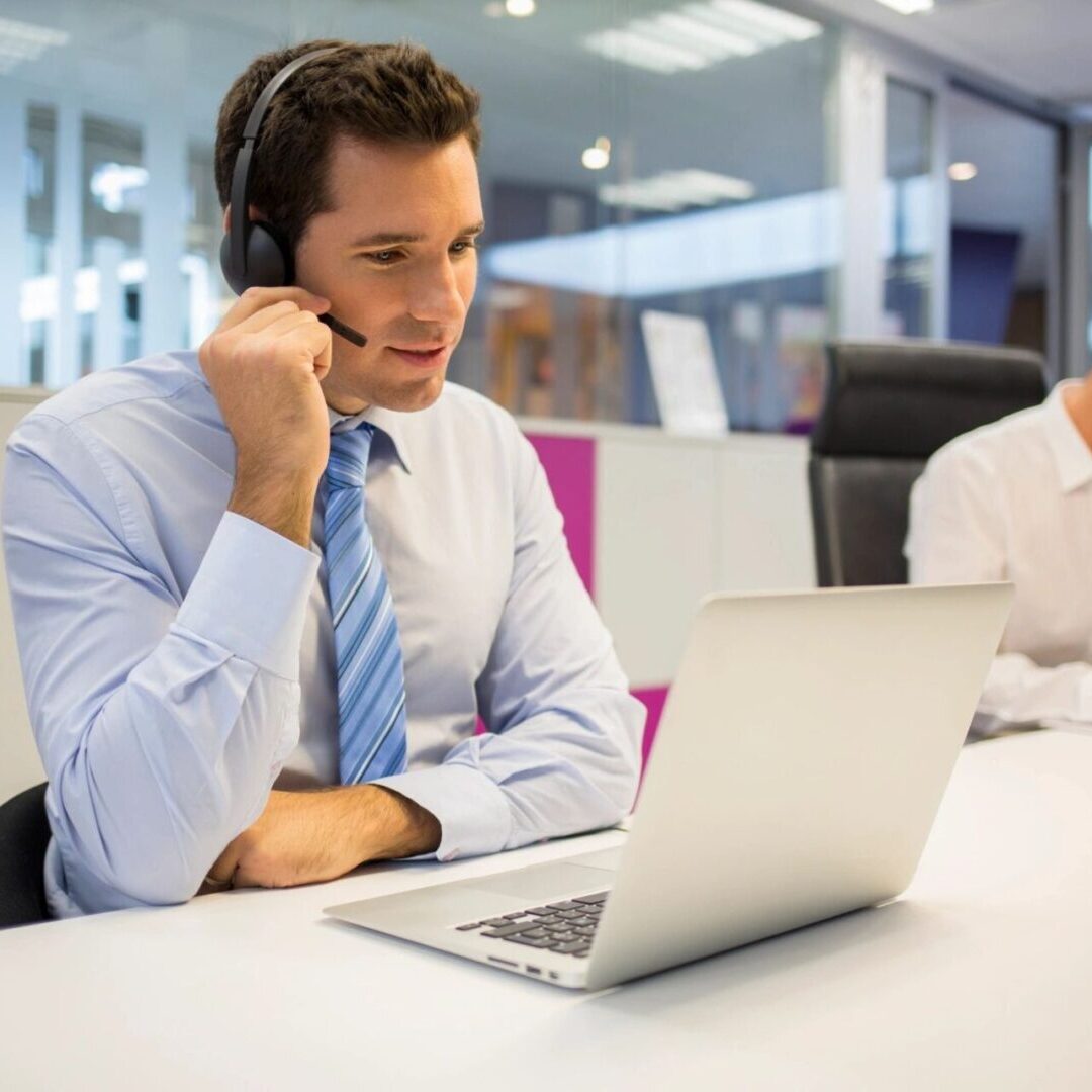 Man at Office on the Phone With Headset